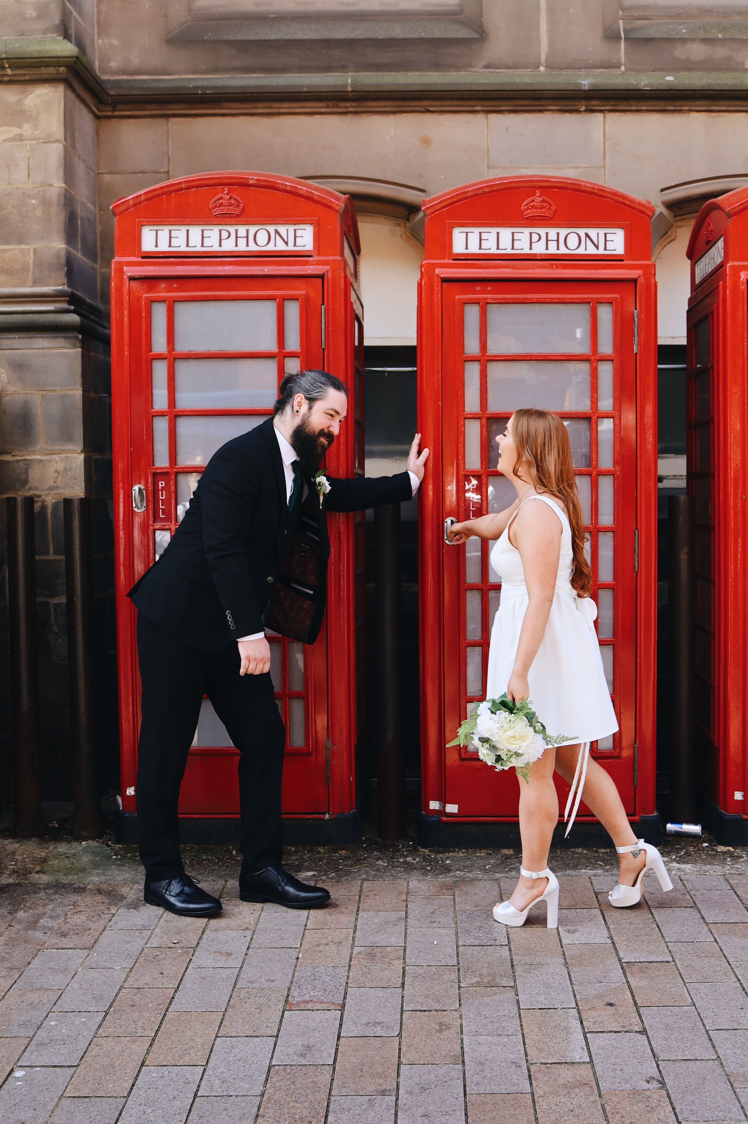 A playful wedding photo sequence with red British telephone booths in the background.