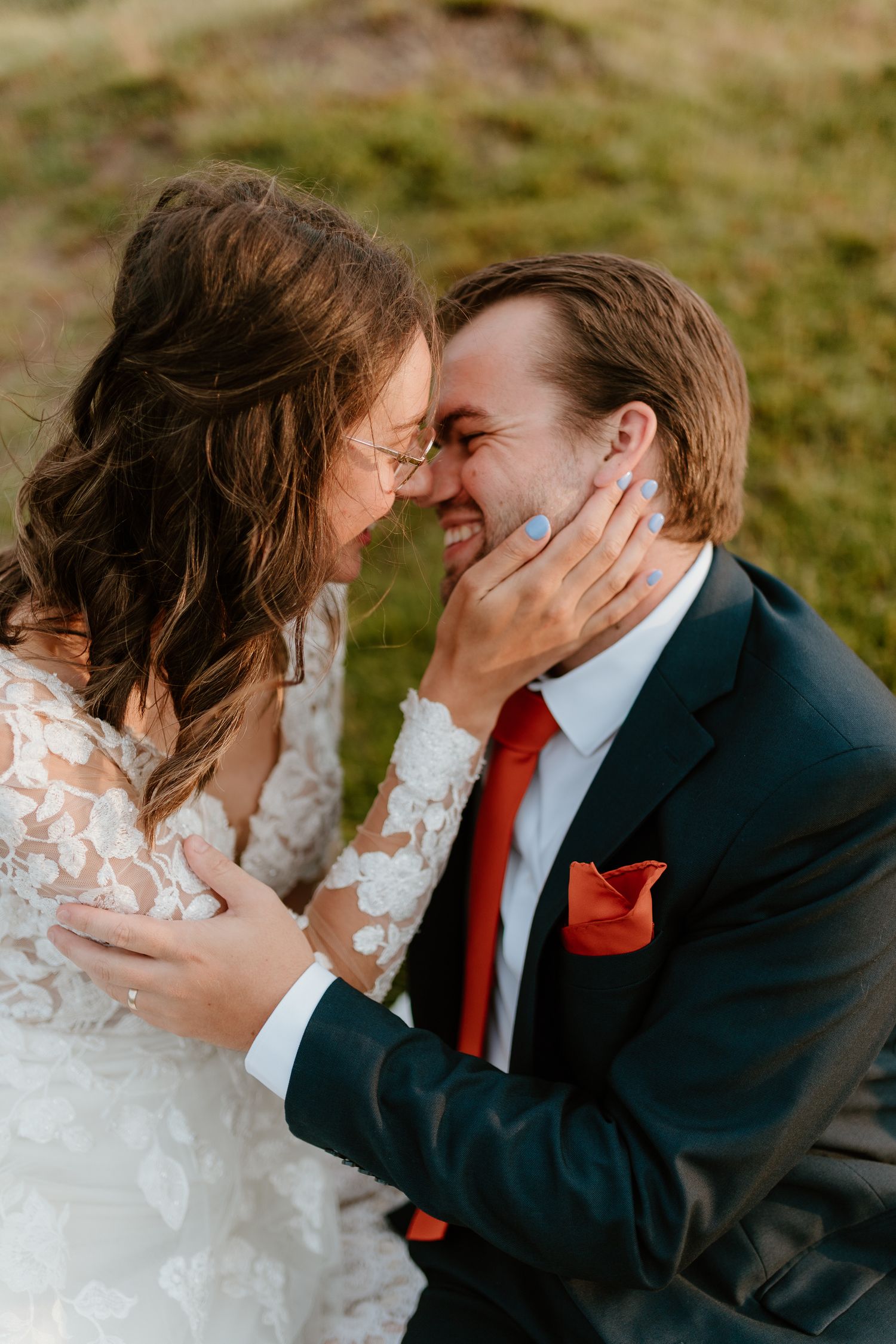 bride and groom holding each other about to kiss