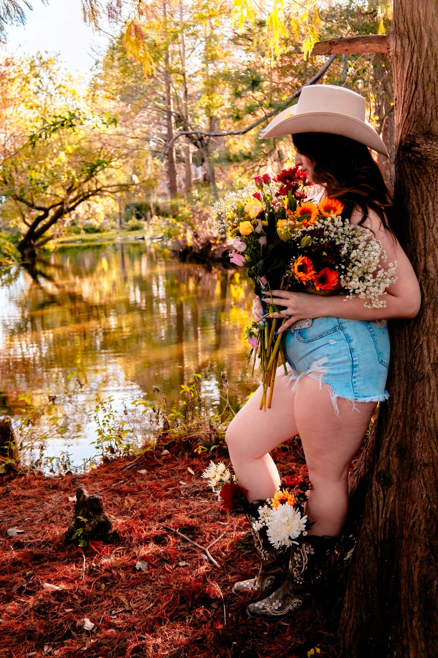 Rural lakeside scene with autumn colors and floral arrangements.