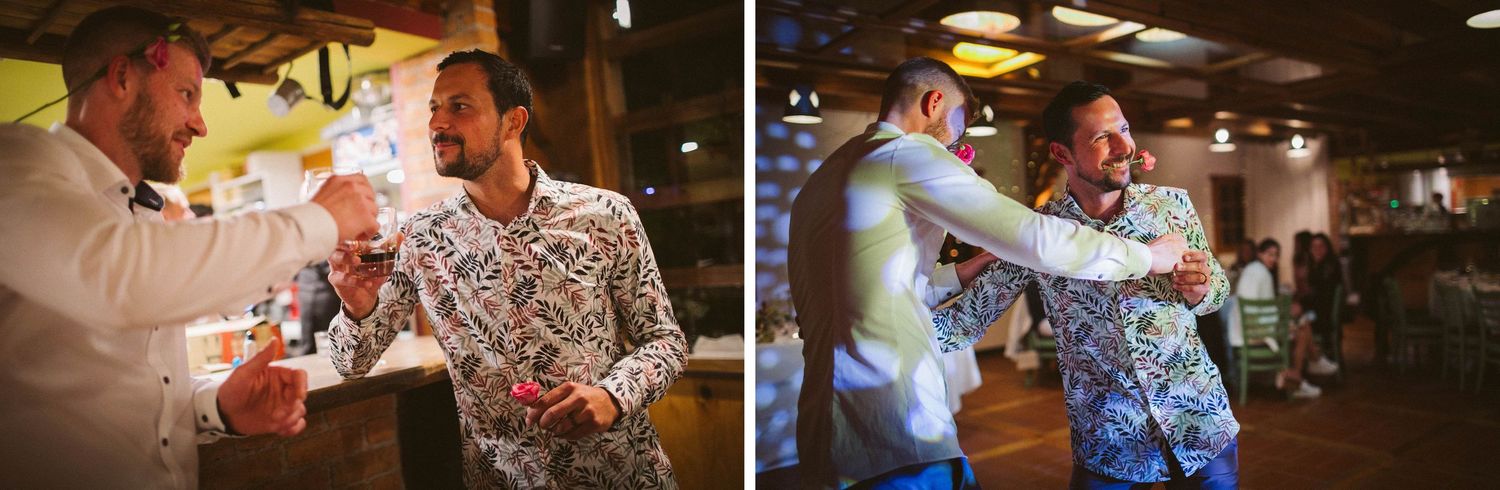 Wedding guests enjoy a lively dance moment on the reception dance floor with colorful lighting.