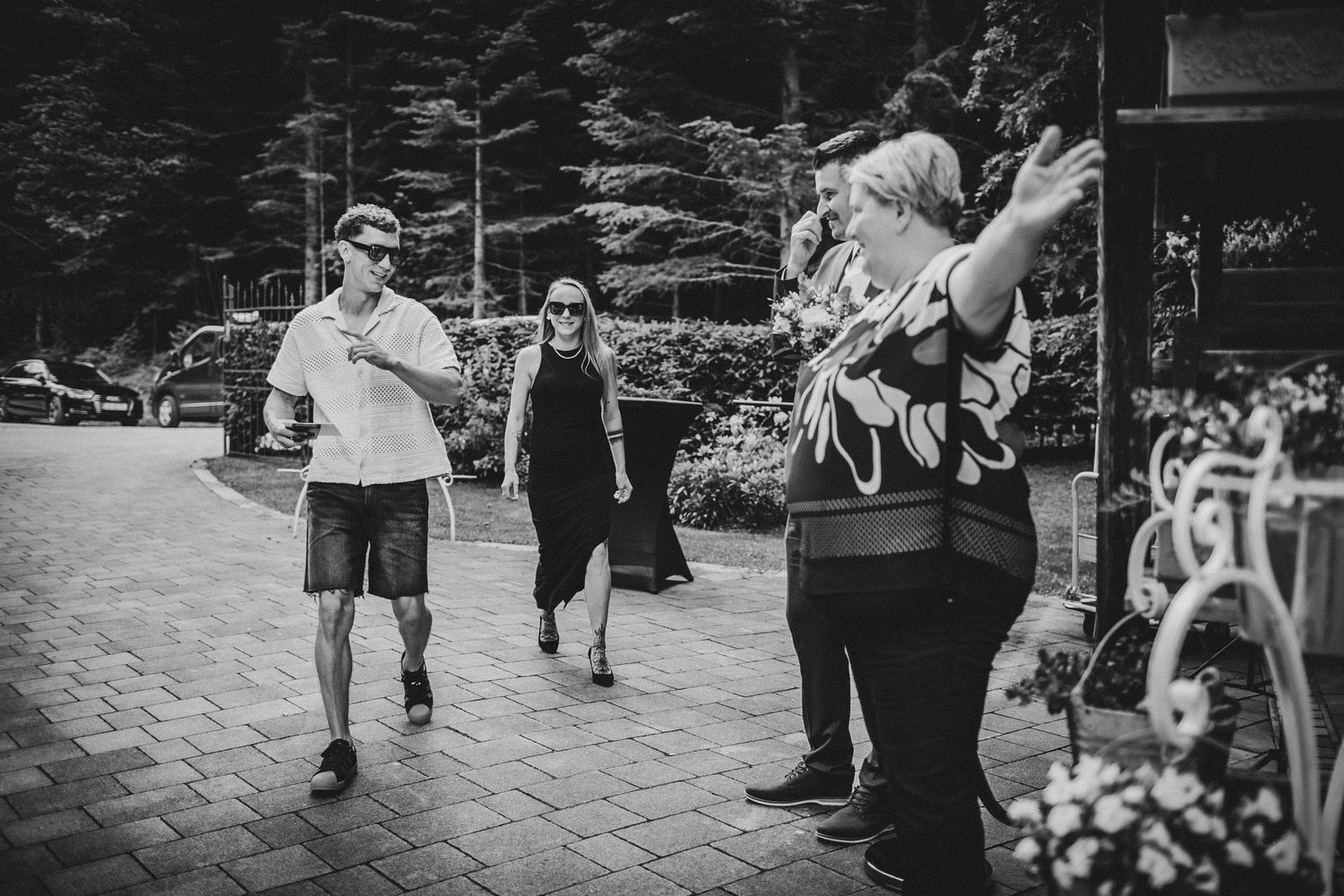 People interacting on a paved walkway during an outdoor event.