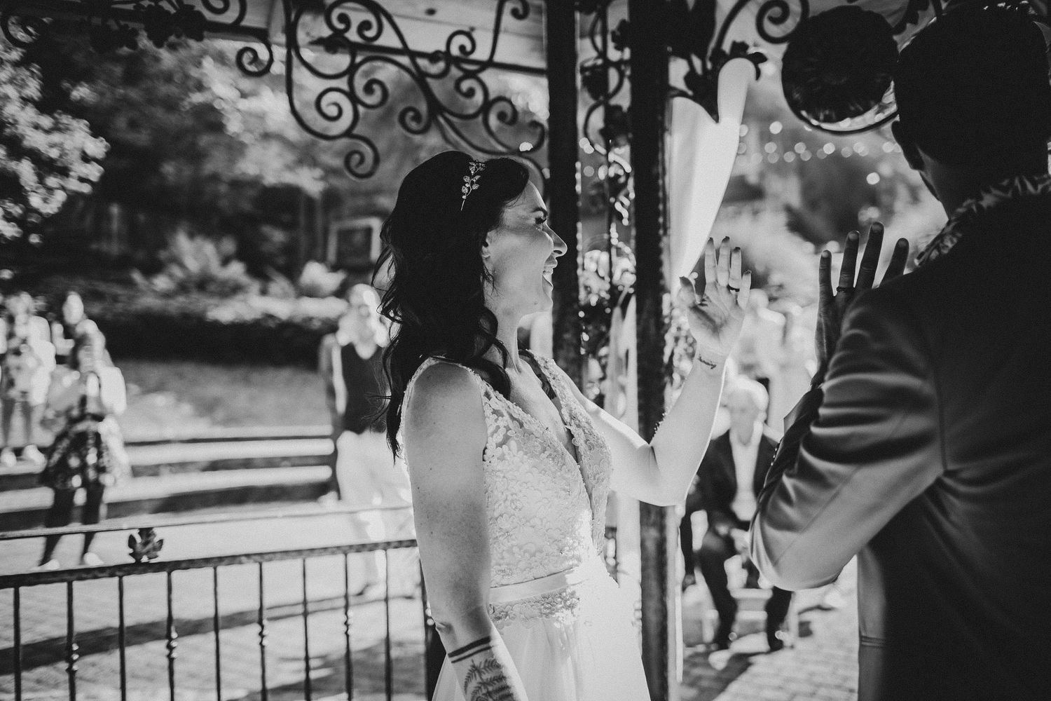 A black and white capture of a heartfelt wedding ceremony moment.
