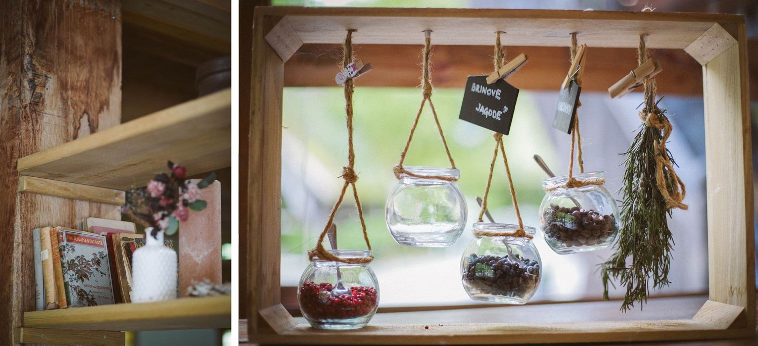 Creative display of hanging glass terrariums with plants and decorative elements.