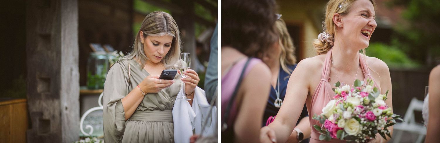 Wedding attendees share joyful moments at an outdoor summer reception.