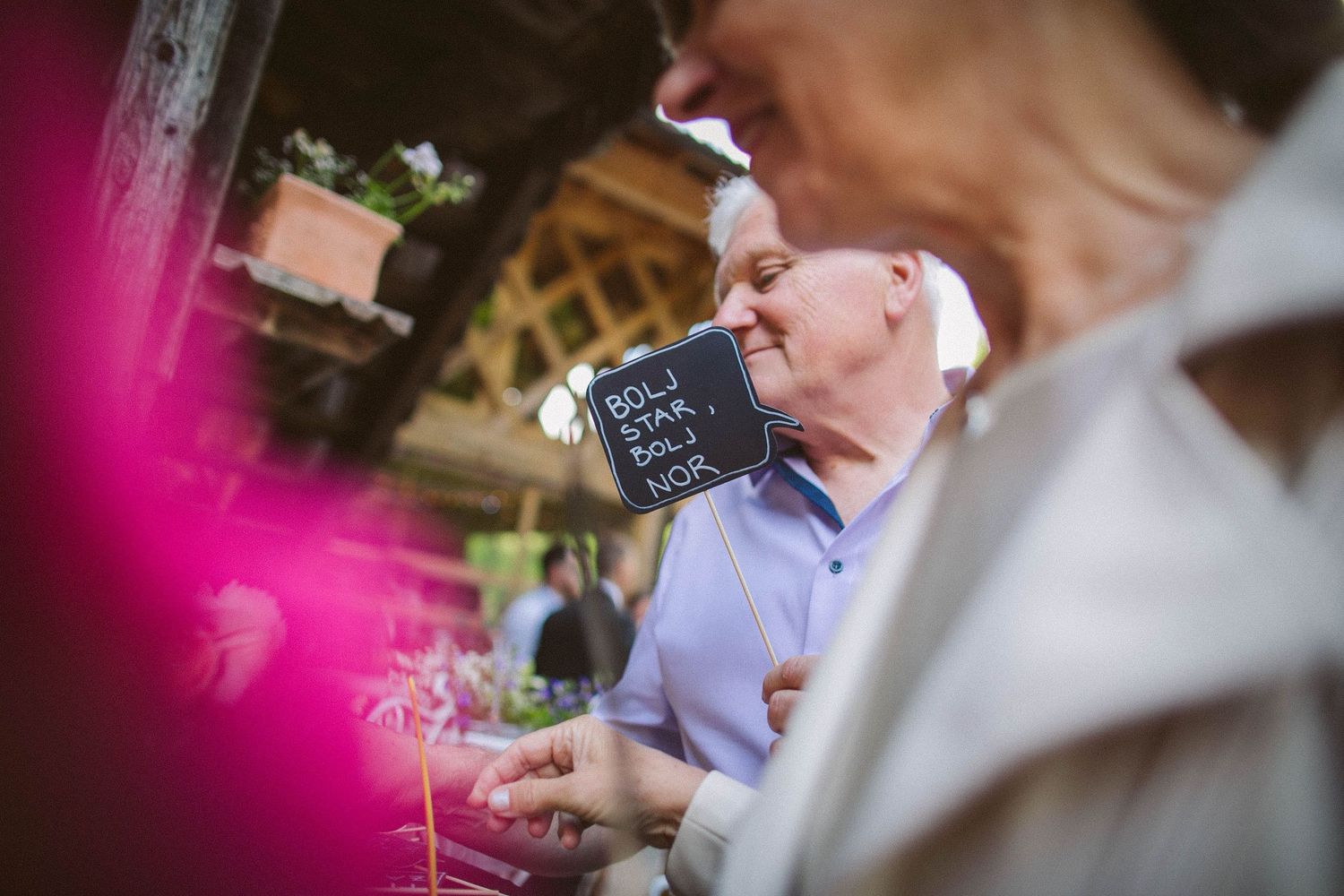 Guest enjoying drinks at outdoor wedding reception.