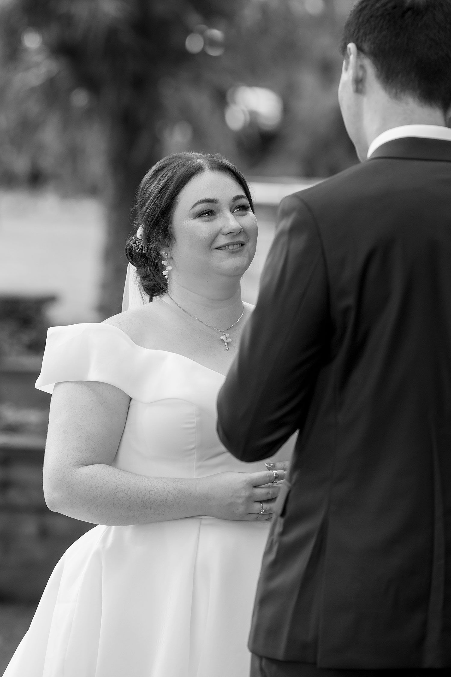 Bride and Groom share a moment during their wedding vows at their outdoor ceremony at Gabbinbar Homestead in Toowoomba Queensland.