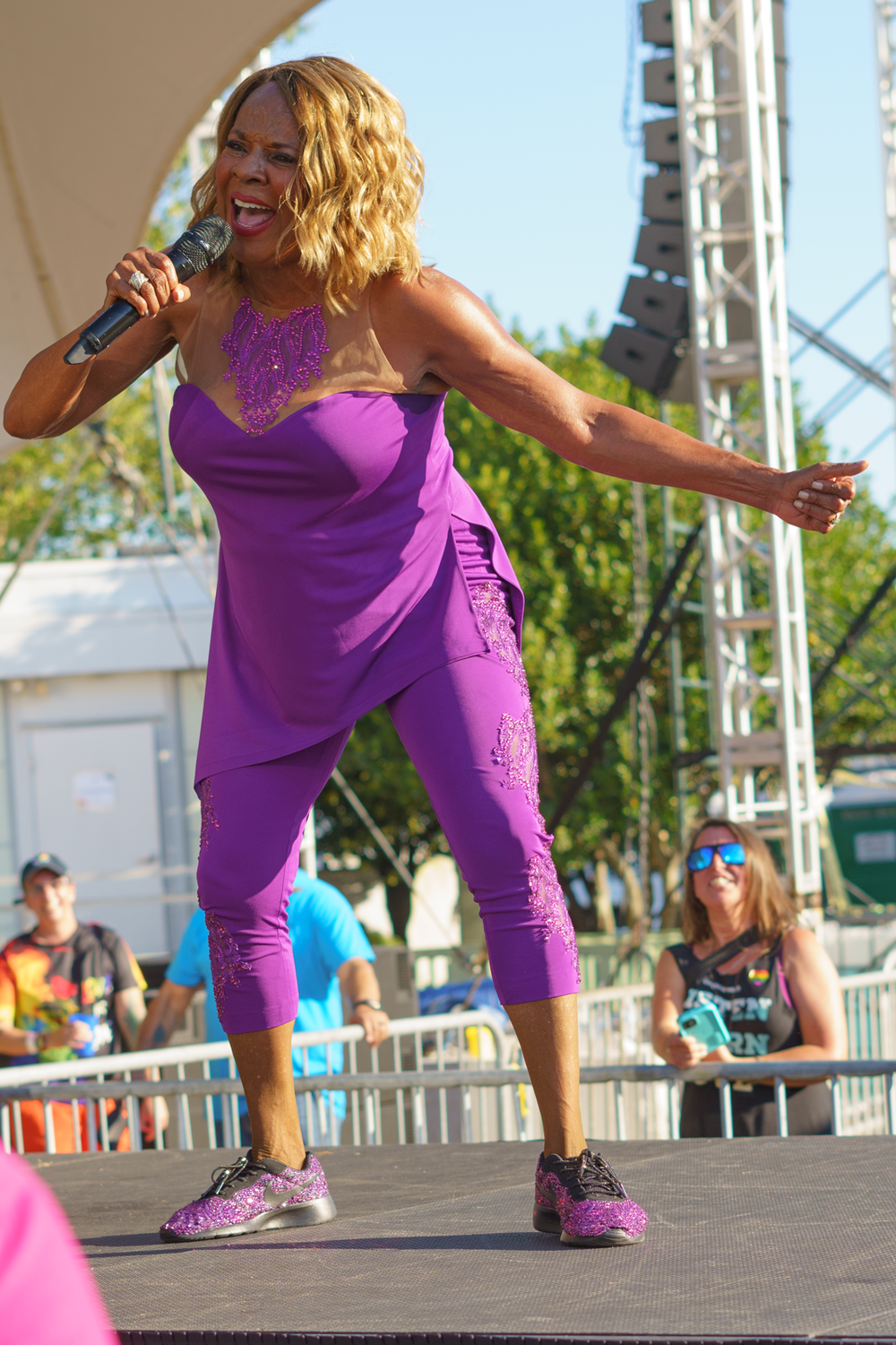 Norfolk Pride 2021, a performer on stage singing her heart out to a joyful crowd