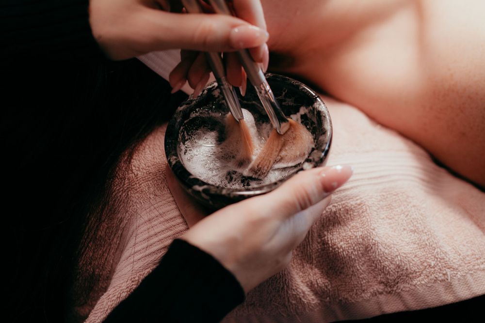 Dental professional performing oral examination with specialized tools.