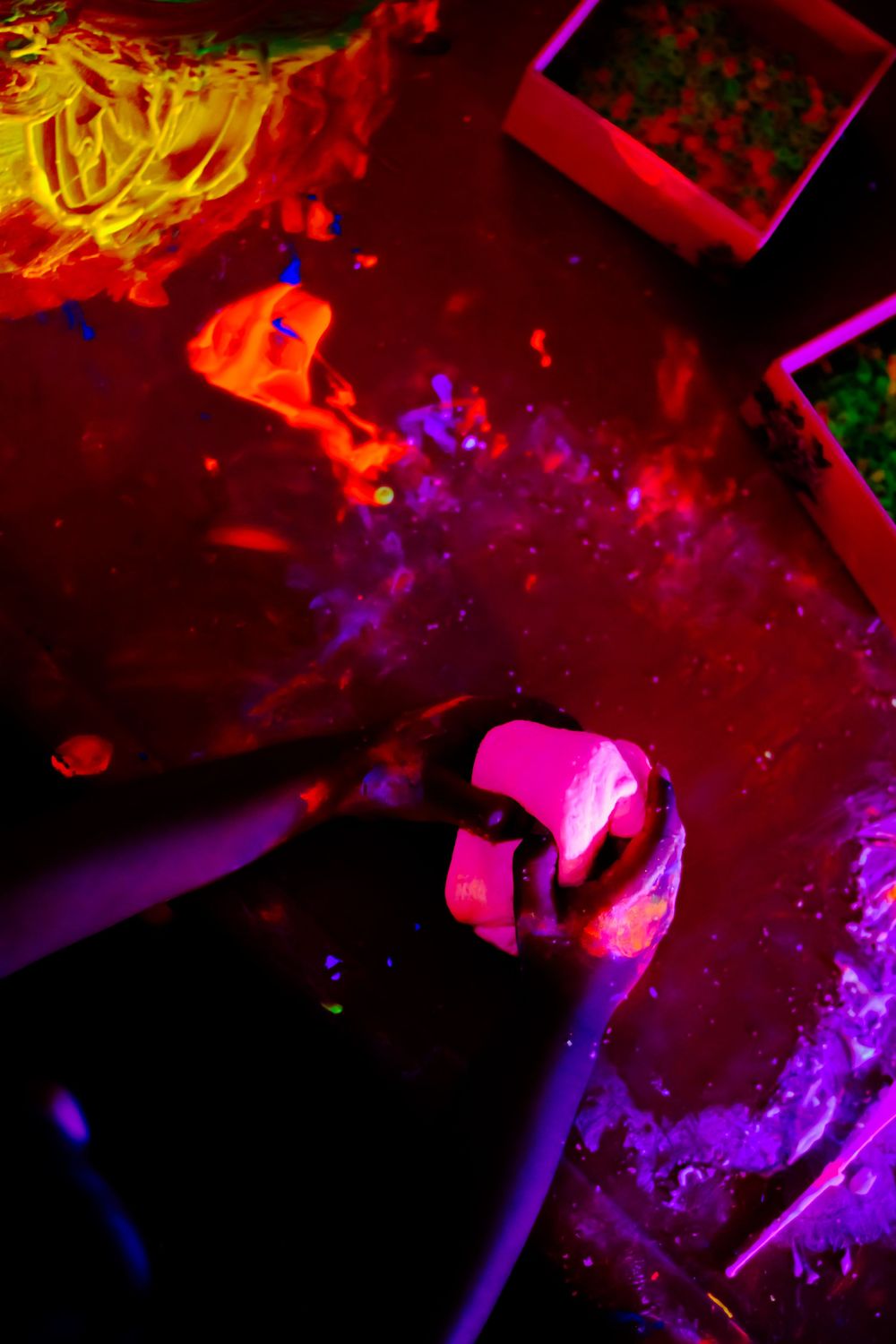 Colorful abstract scene with red and purple lighting effects and geometric shapes.
