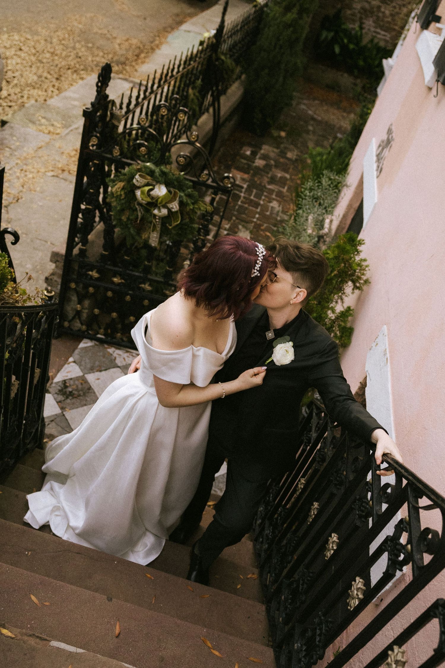 A bride and groom smiling at each other as they leave their ceremony walking down the aisle