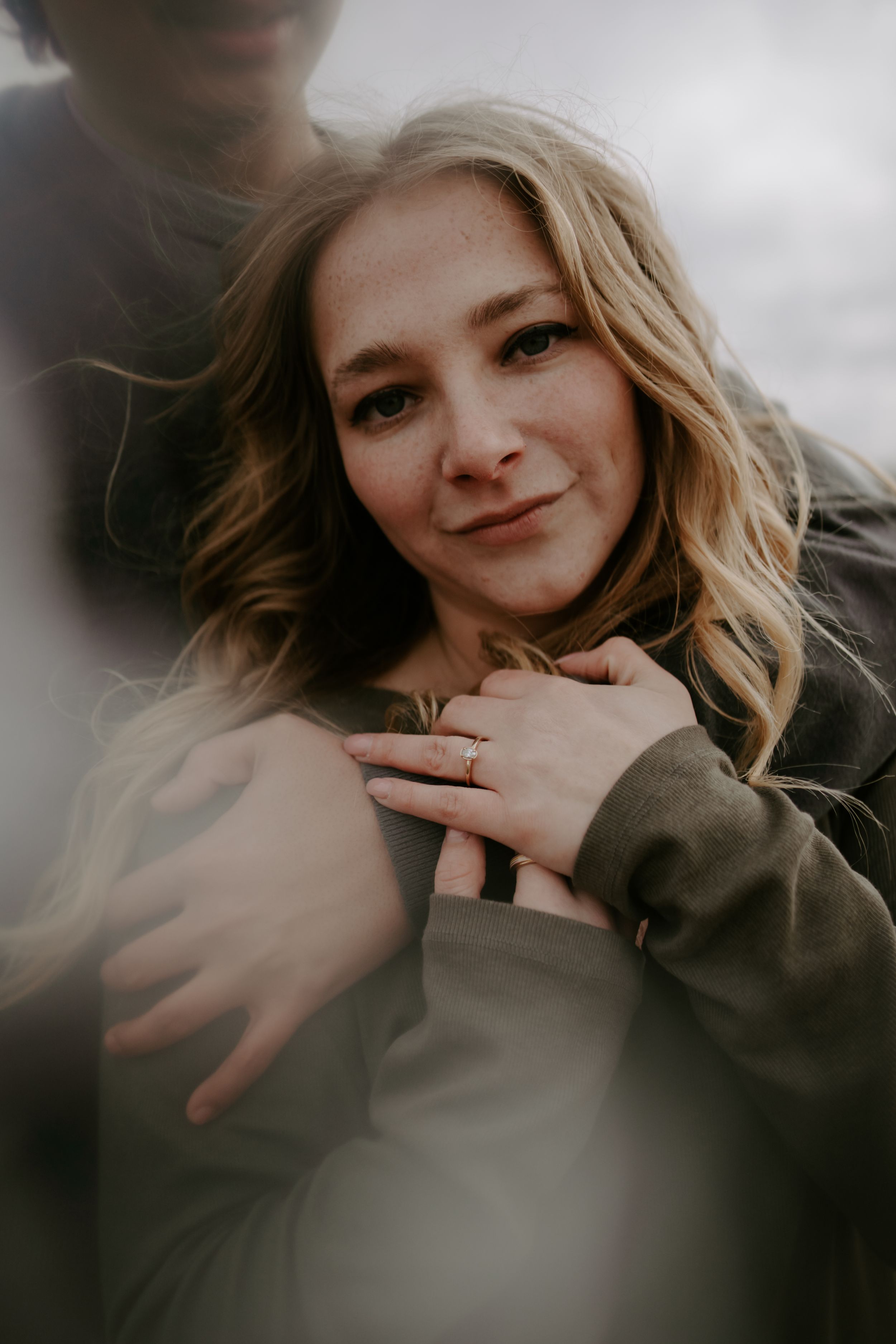 Close-up portrait in soft lighting showing gentle expressions and natural emotion.