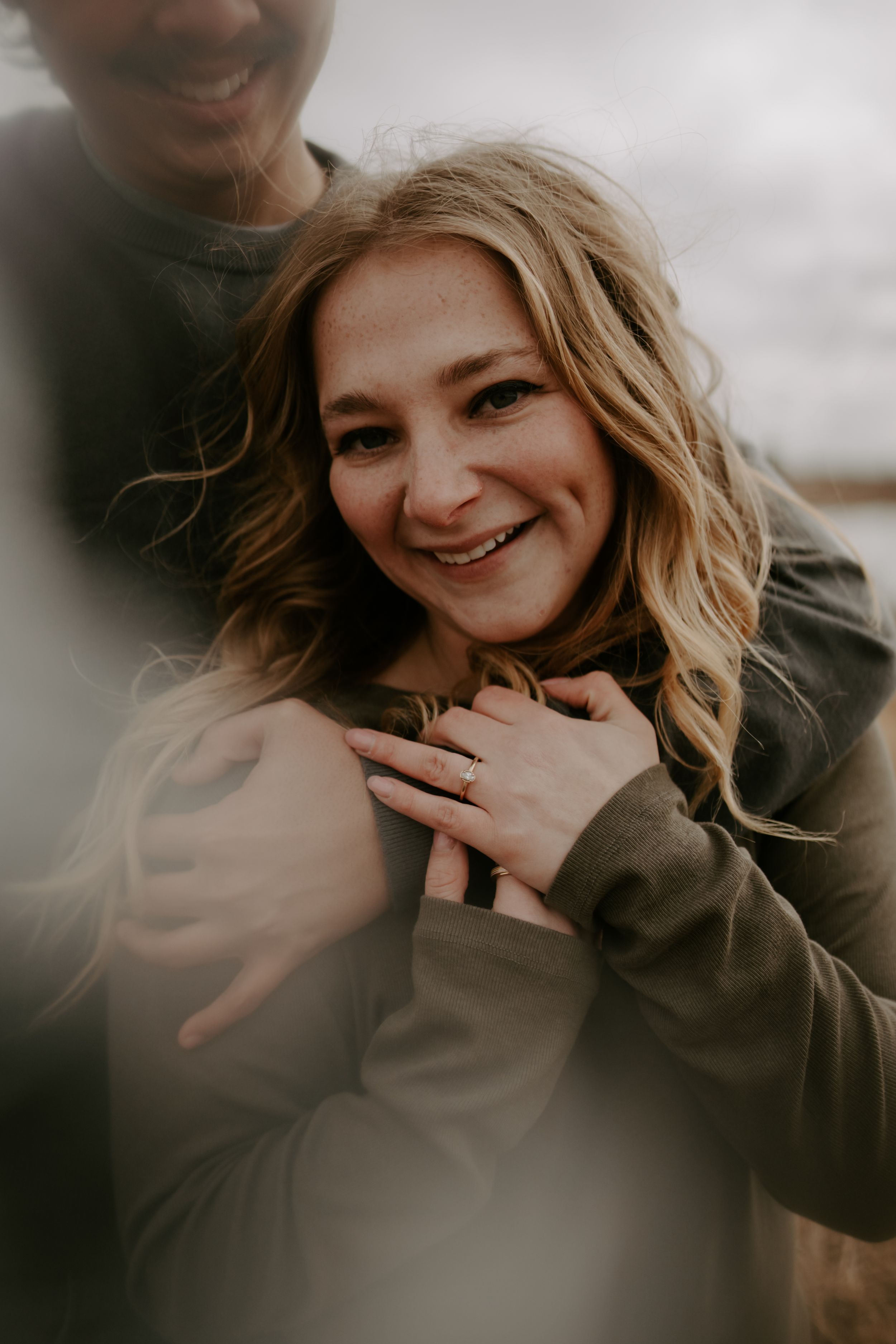 Intimate close-up portrait showing genuine smiles and tender moments.