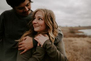 Tender romantic moments captured in a natural outdoor setting.