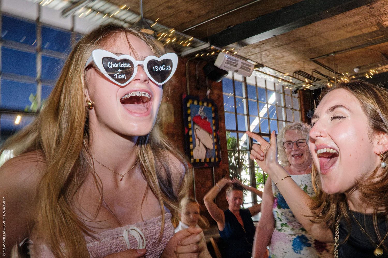 Group of friends laughing and having fun together at a social gathering.