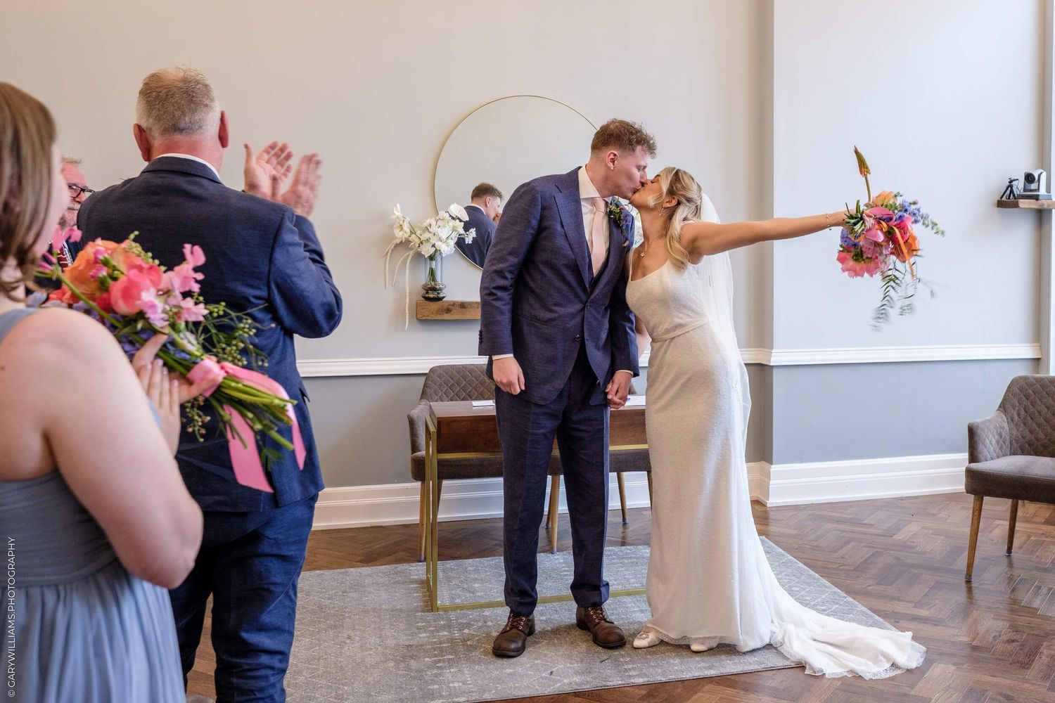 A timeline sequence showing a couple's first dance at a wedding in a bright white space near windows.