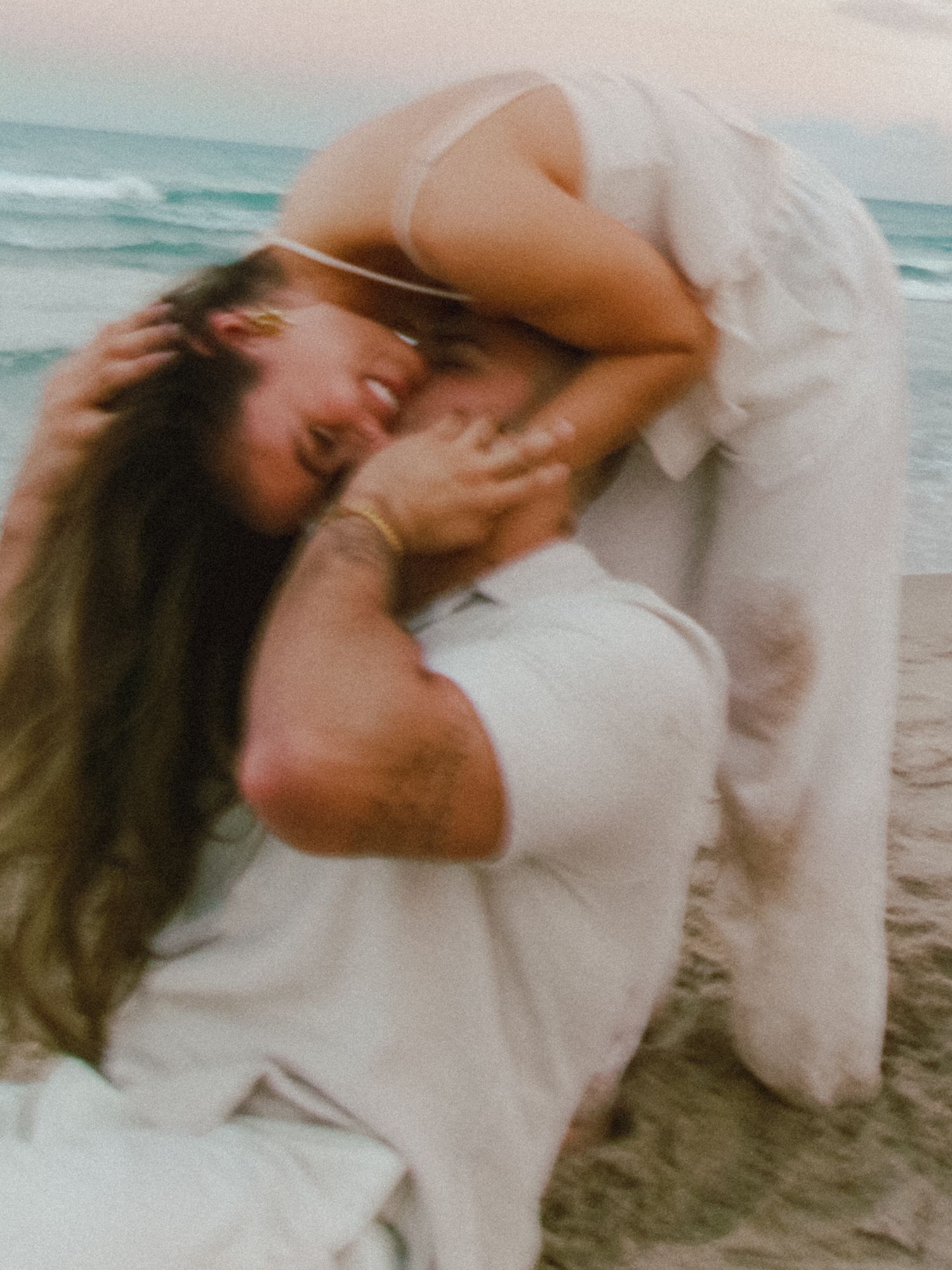 Fun at the beach celebrating love and an engagement.