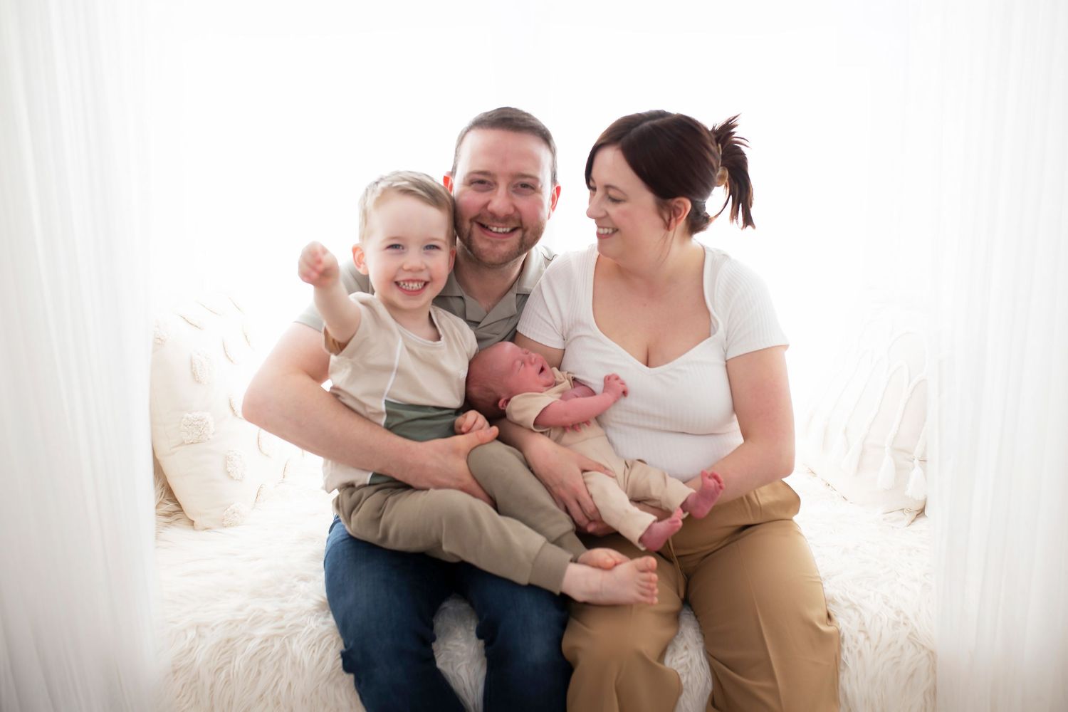 Newborn Family photoshoot mum dad brother and baby by Little Wonderland Photography Widnes Cheshire