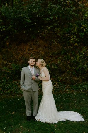Candid wedding portraits taken outdoors with lush green foliage in the background.