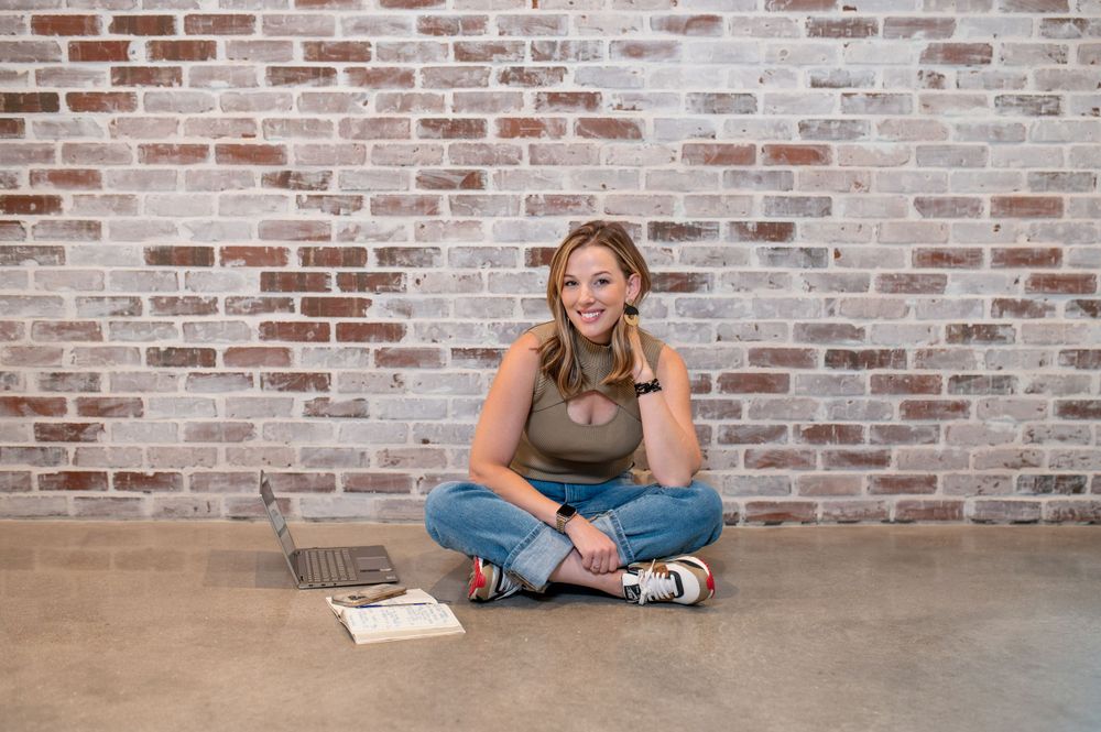 Casual lifestyle photos against exposed brick wall in modern industrial space.