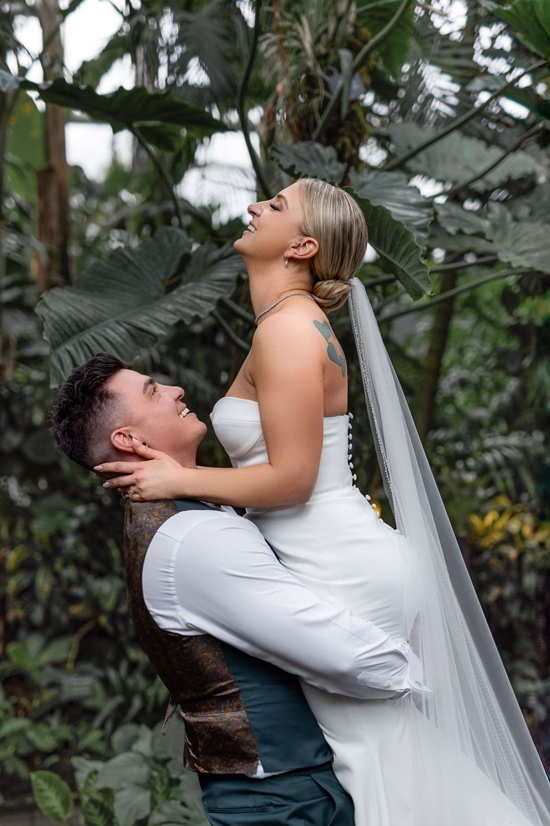 Classic Edmonton wedding portraits of a bride and groom, taken at breathtaking Muttart Conservatory.