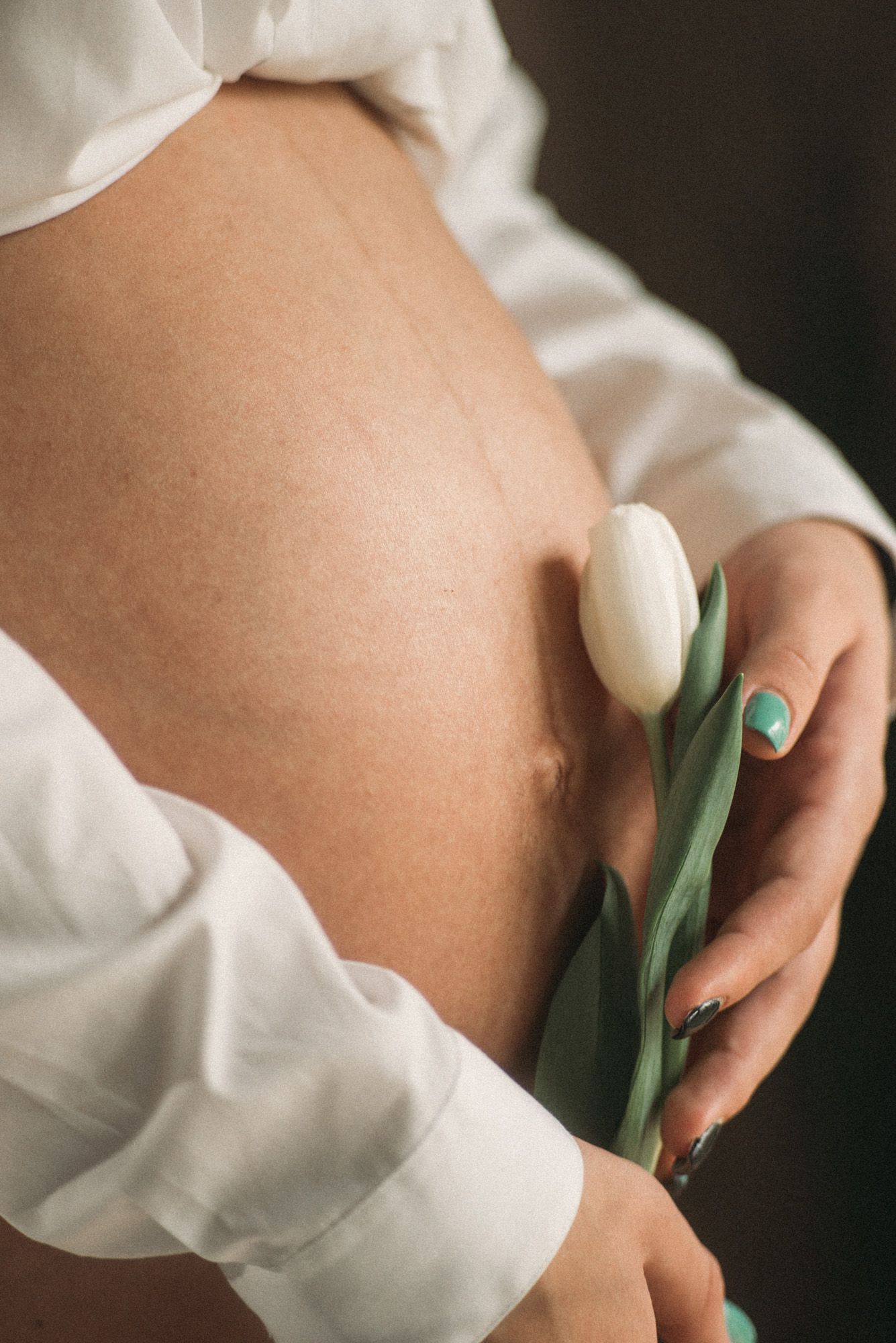 Close-up artistic shots featuring white fabric and green stems creating visual contrast.
