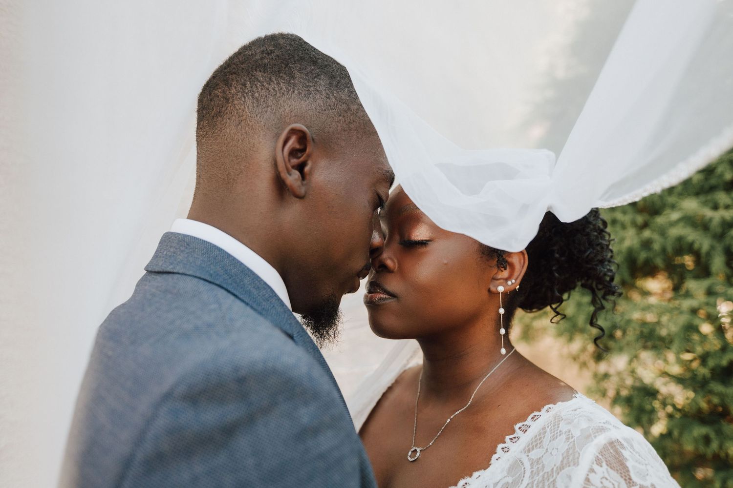 A romantic bride and groom posing for wedding portraits at wedding venue Elegant Celebrations in Collegeville, PA.