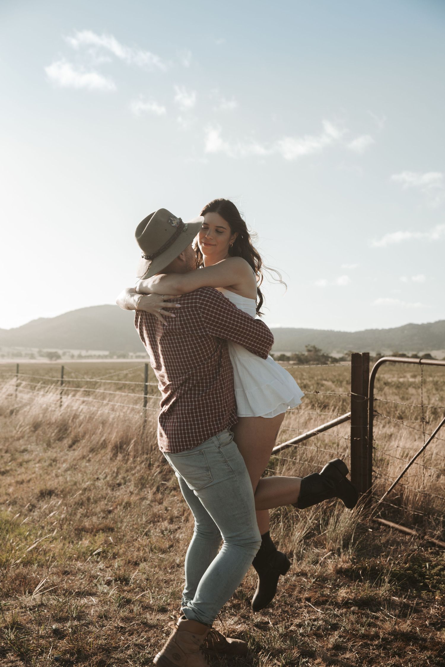 Country couple photoshoot, western couples photography, rustic romance, cowboy and cowgirl, countryside love story, golden hour portraits