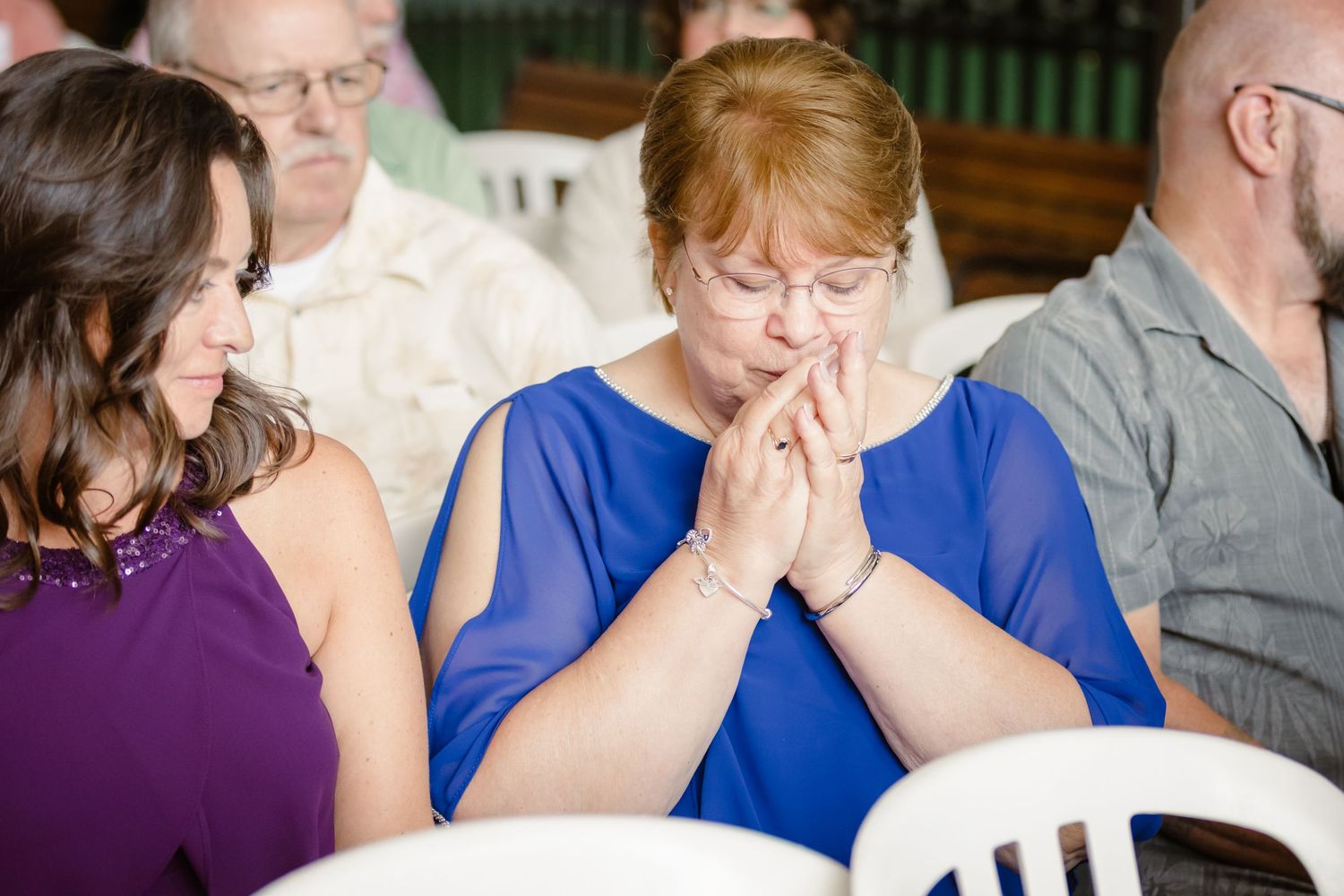 A series of emotional reactions captured in a sequence of photos showing people in blue and purple attire.