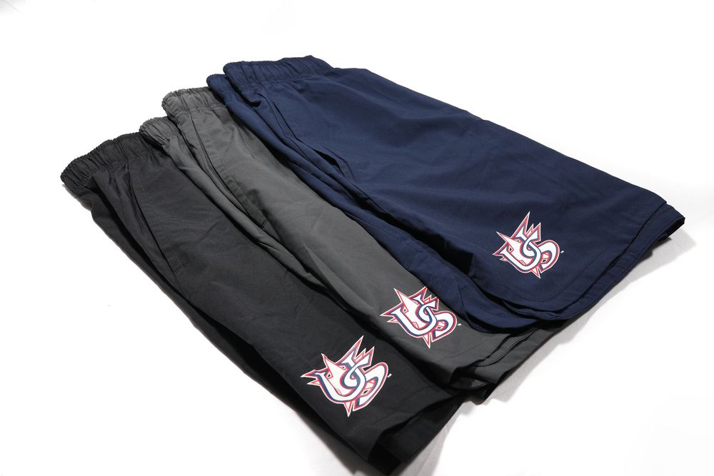 Three USA Baseball athletic shorts in black, gray, and navy with embroidered logo.
