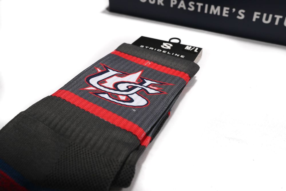 USA Baseball Strideline athletic crew socks in black with red stripes and embroidered team logo.