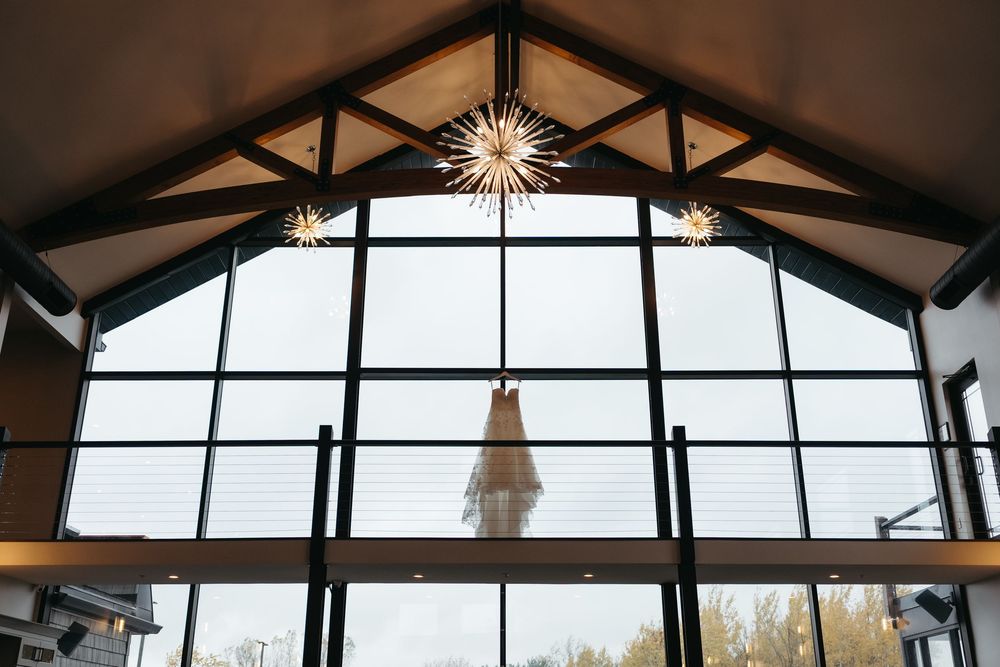 Large windows in a modern building's ceiling create dramatic lighting patterns and shadows on the interior space.