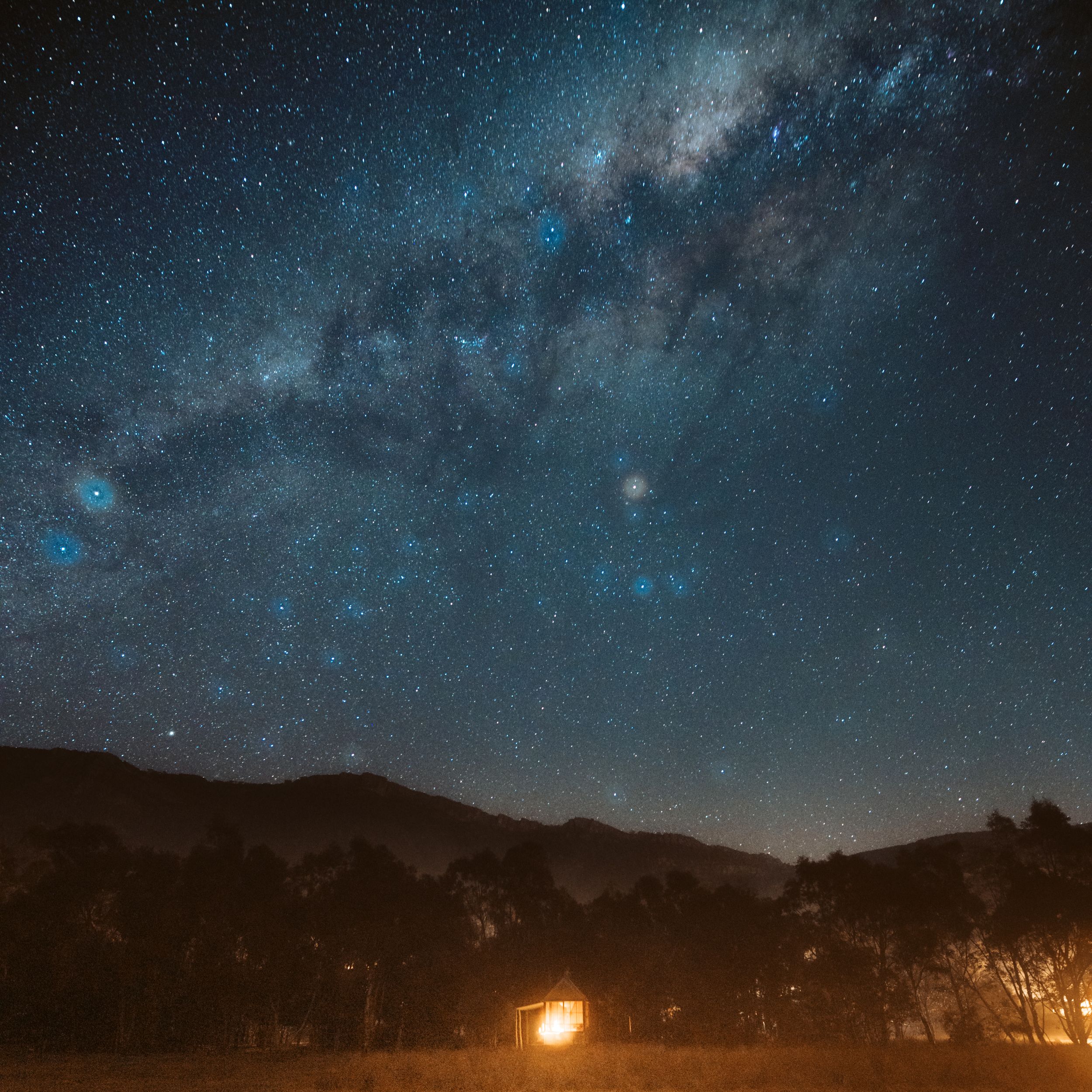 Milky Way galaxy and starry night sky over mountain silhouette in Grampians Region Victoria"
