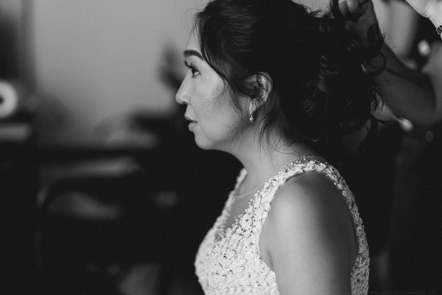 Black and white close-up portraits showing wedding day preparations.