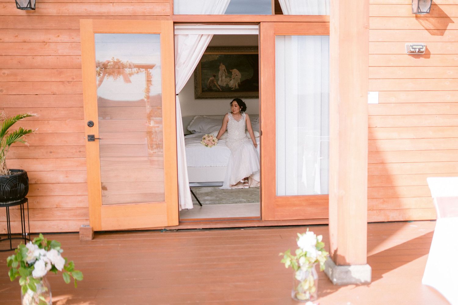 Rustic wooden interior with orange-tinted walls and natural lighting streaming through multiple windows.