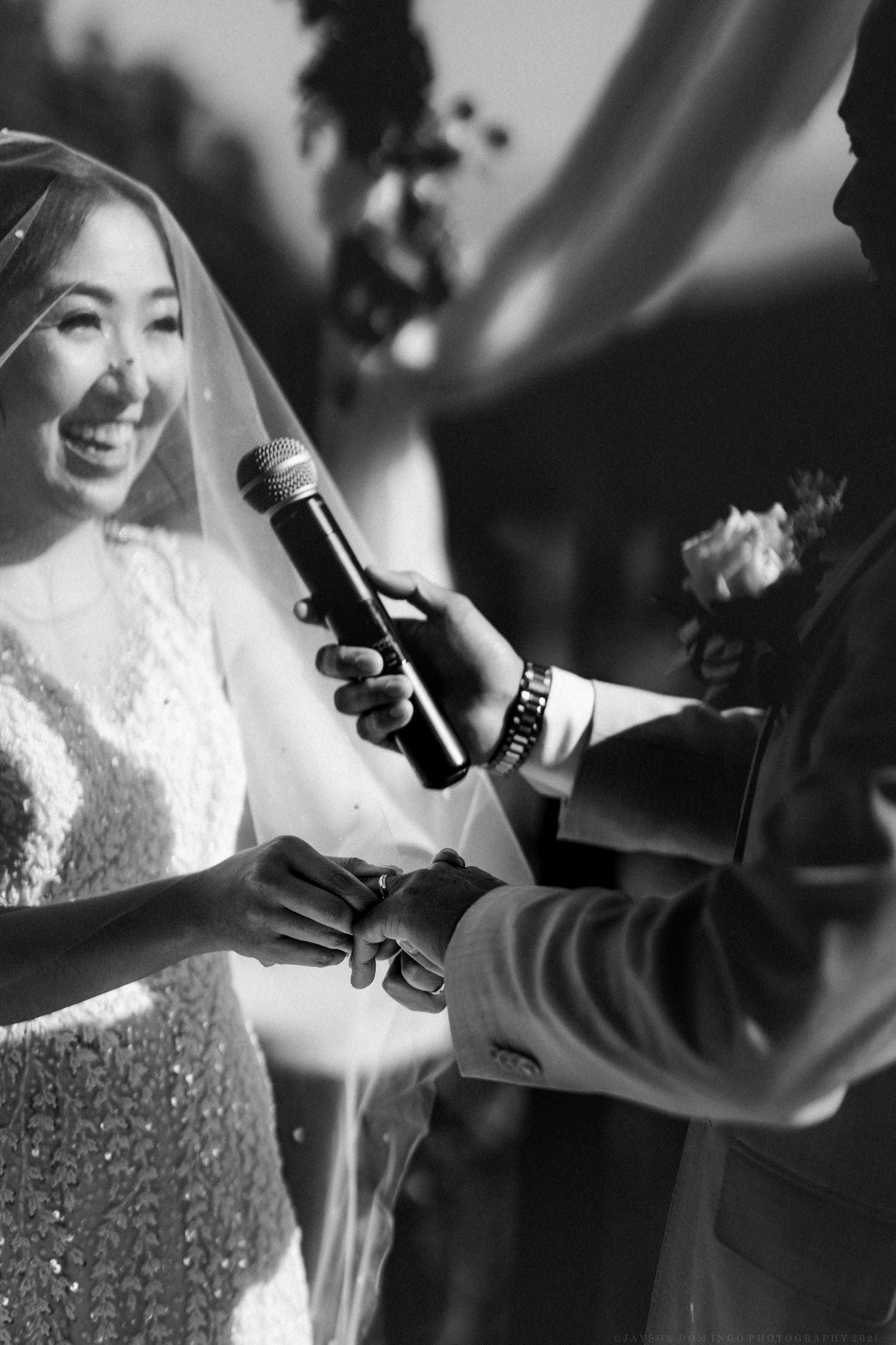 Black and white close-up shots of wedding preparations with lace dress details.