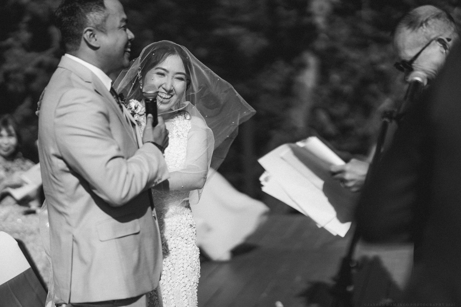Black and white photo capturing intimate moments during a wedding celebration.