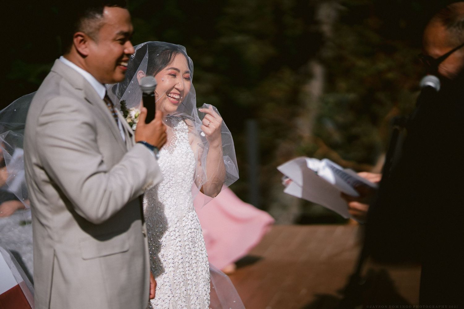 Candid moments of joy during an outdoor wedding ceremony.