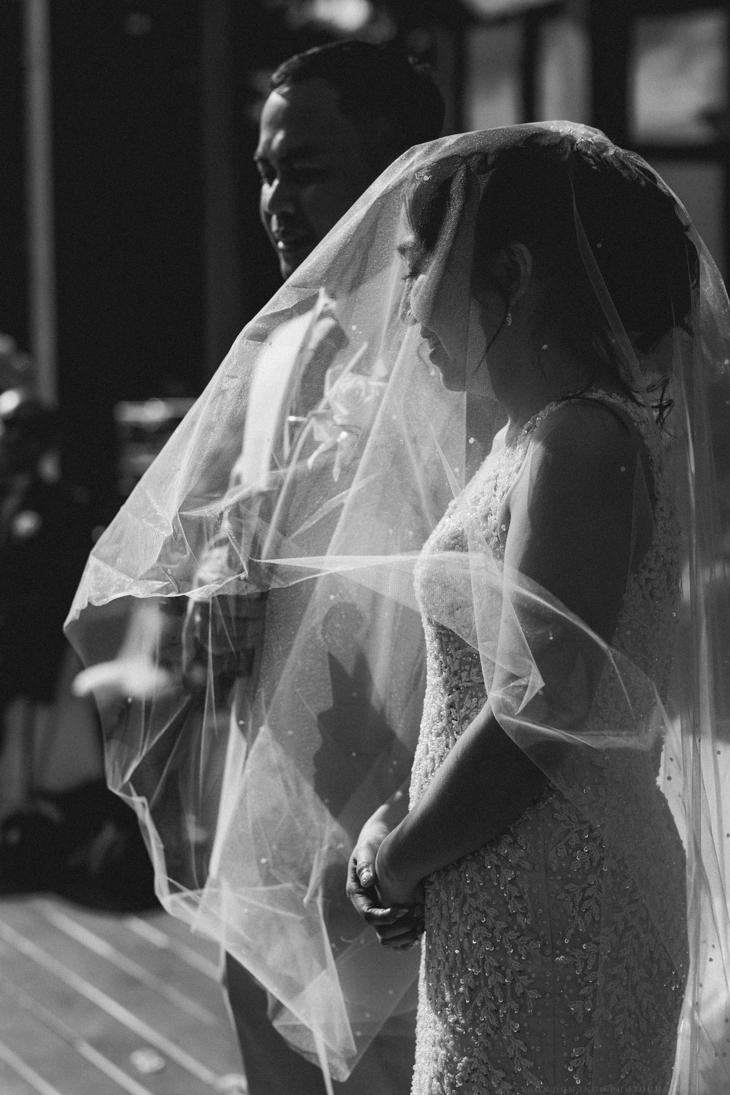 Black and white sequence showing the flowing movement of a bride's veil in different poses.
