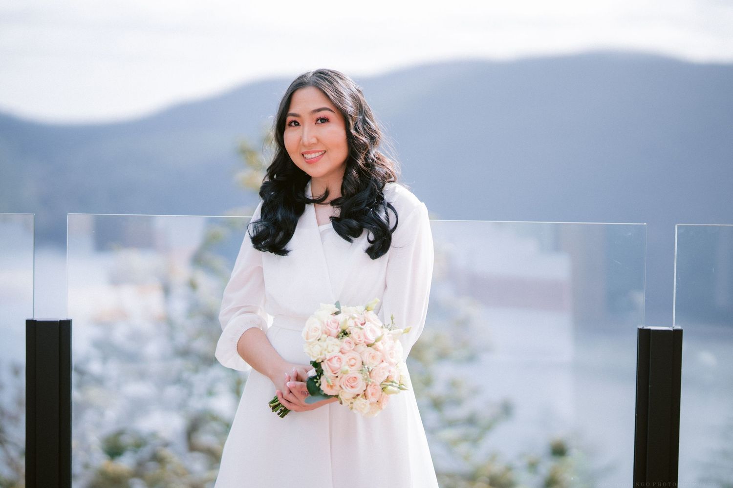 A wedding ceremony setup with mountain views and elegant decor.