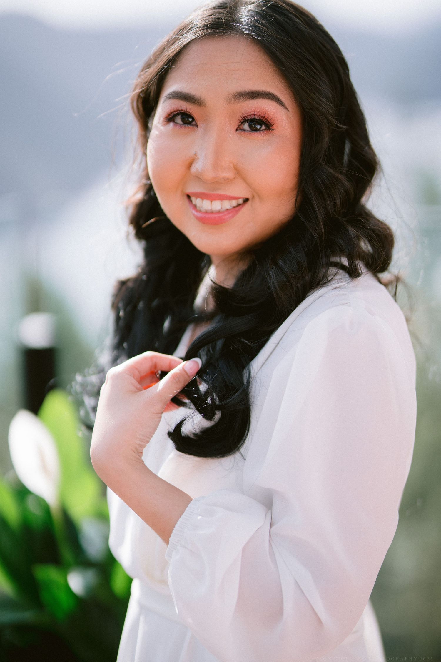 Close-up portrait shots showing joyful expressions in white attire against a soft blurred background.