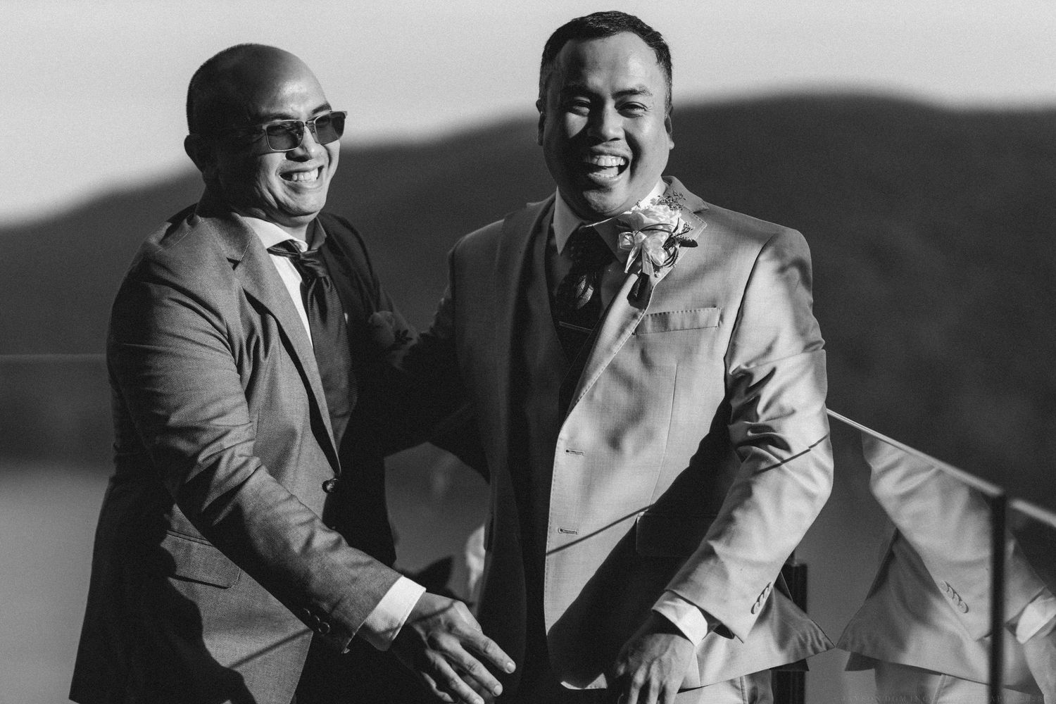A series of black and white photos showing two people in formal attire laughing and interacting together.