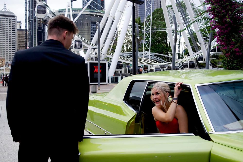 A series of photos showing a green car and industrial architecture in an urban setting.