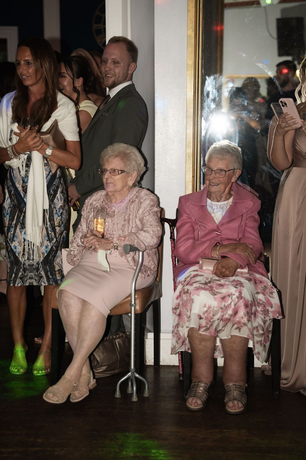 A sequence of photos showing elderly women sitting in chairs at what appears to be a social gathering or event.