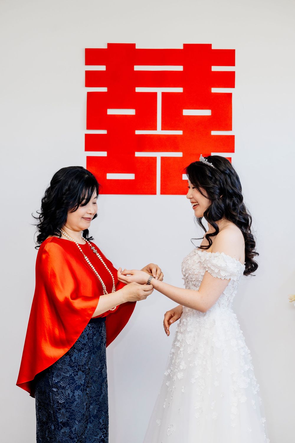 Two figures in contrasting red and white attire share a joyful moment in a sequence of four photos.