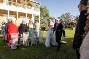 wedding ceremony photography, bride walking down the isle with her father. outdoor ceremony