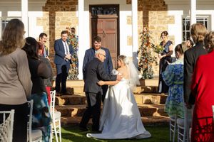 heartfelt wedding ceremony, bride meeting groom at the alter after hugging her farther.