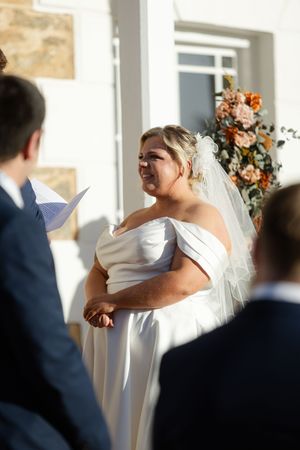 An intimate wedding ceremony sequence showing emotional reactions between the couple.