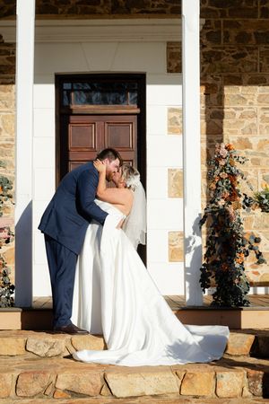 Newley weds celebrate with a first kiss