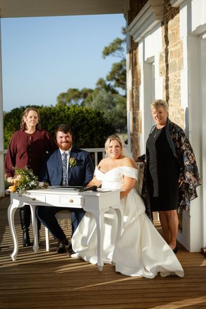 Newley weds signing their wedding certificate, Kirsten Graham wedding photography