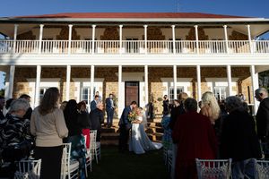 wedding guest cheer as the Newley weds kiss walking down the isle.